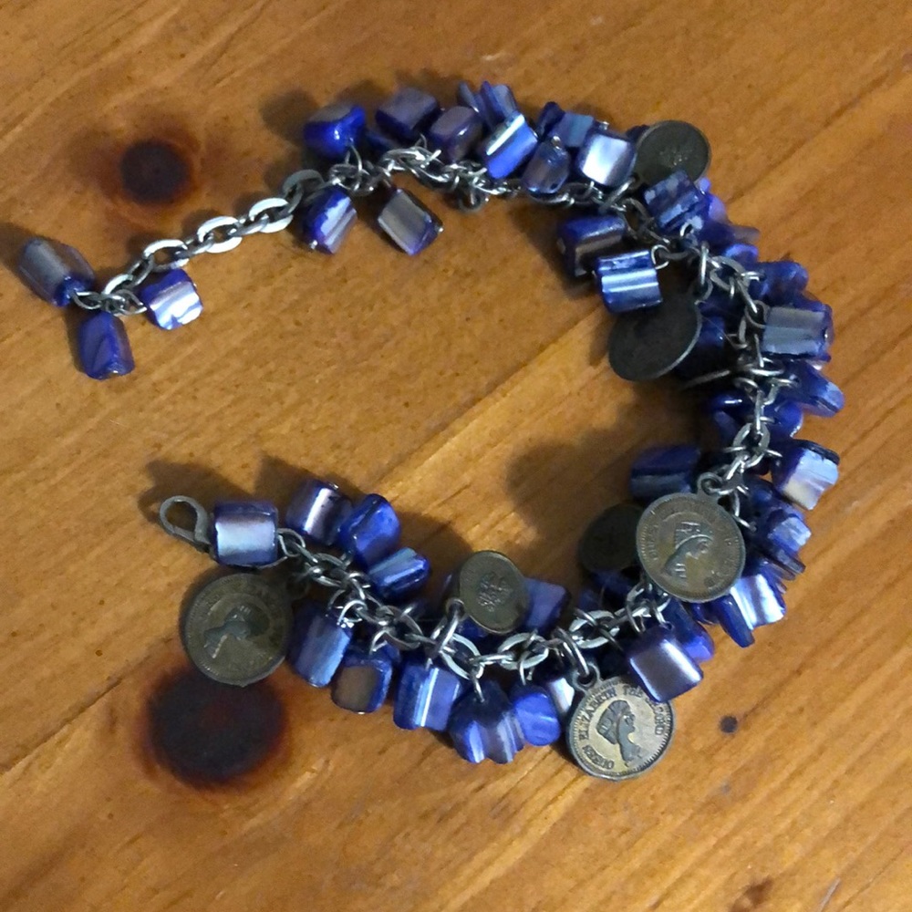 Purple shell bead and coin bracelet